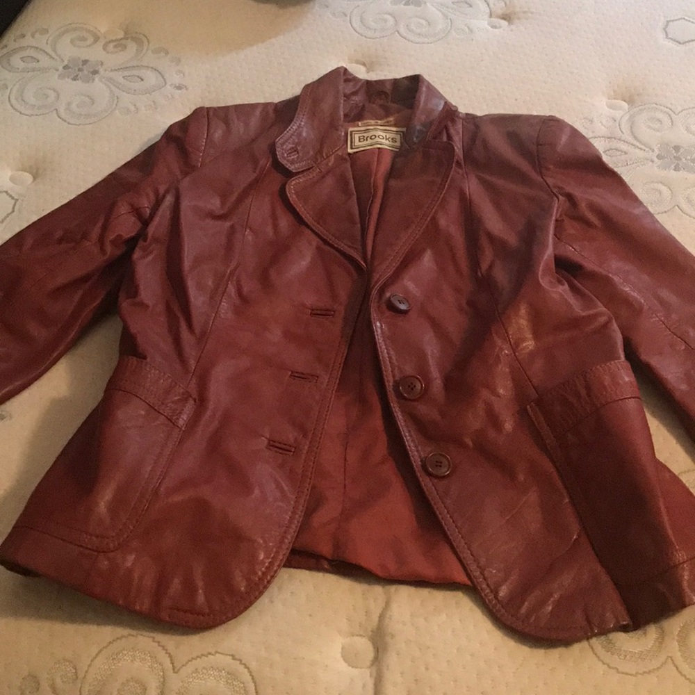 Burgundy or dark red jacket